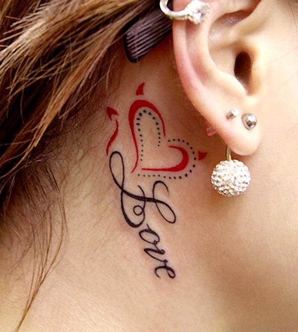 Love Word With Heart Tattoo On Girl Right Behind The Ear