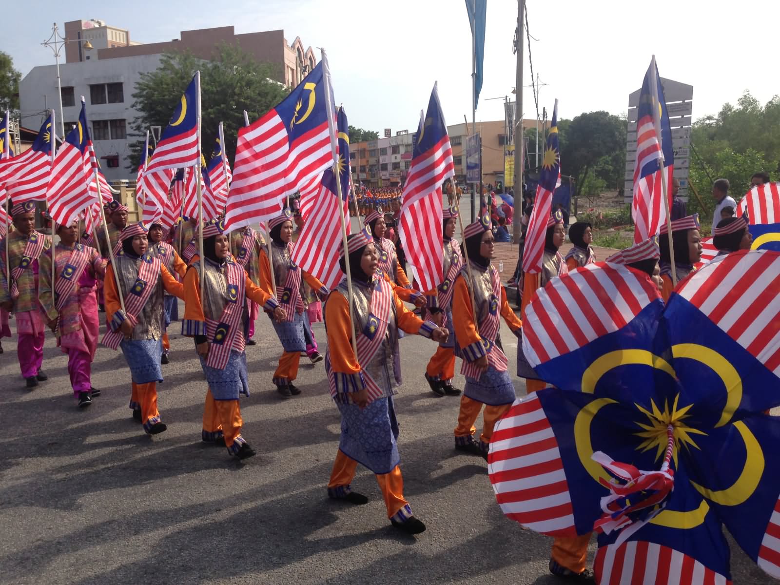 Malaysian Ladies With Flags Celebrating Independence Day Of Malaysia