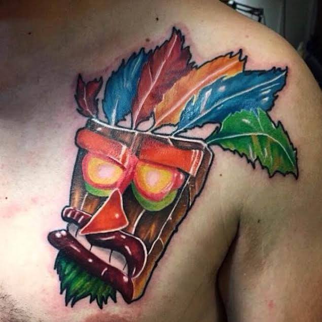 Mardi Gras Tiki Mask Tattoo On Front Shoulder