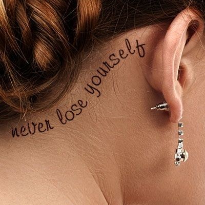 Never Lose Yourself Word Tattoo On Girl Right Behind The Ear