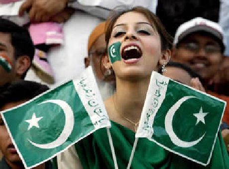 Pakistani Girl With Flags Enjoying The Celebrations Of Pakistan's Independence Day