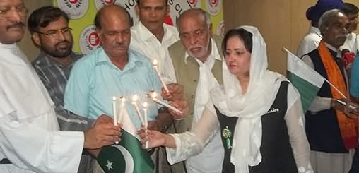 People Of Pakistan Lighting Candles On The Eve Of Independence Day