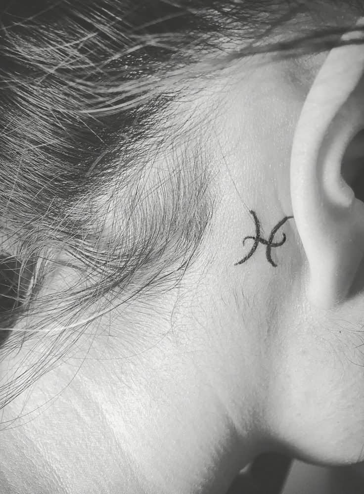 Pisces Symbol Tattoo On Girl Right Behind The Ear