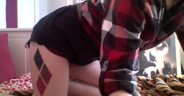 Red And Black Harley Quinn Symbol Tattoo On Right Thigh