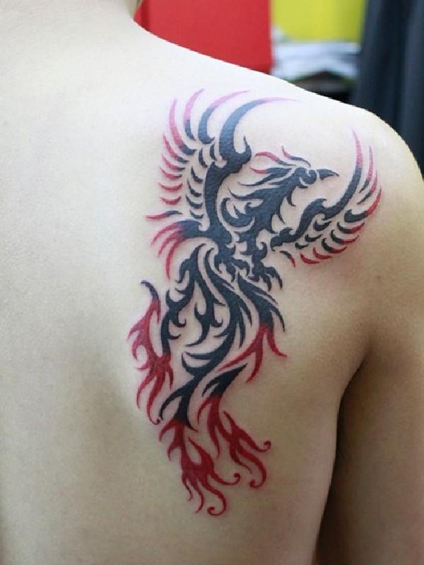 Red And Black Tribal Phoenix Tattoo On Back Shoulder