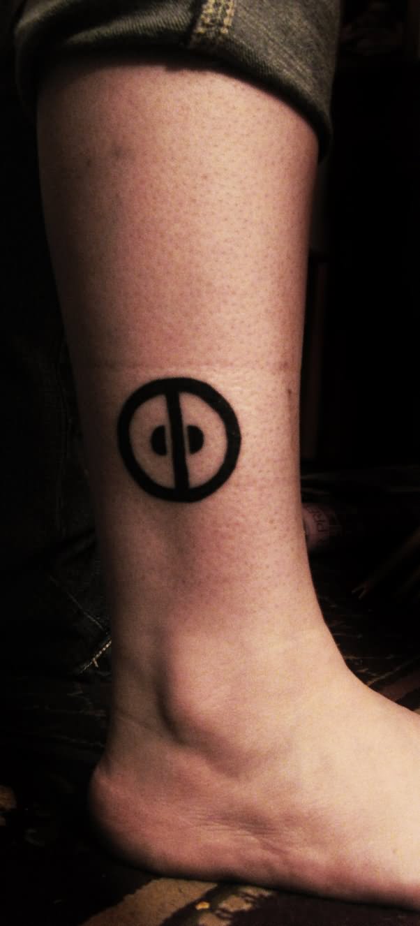 Simple Black Deadpool Symbol Tattoo On Leg By Kari Lindeman