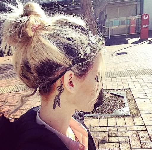 Simple Black Feather Dreamcatcher Tattoo On Girl Right Behind The Ear