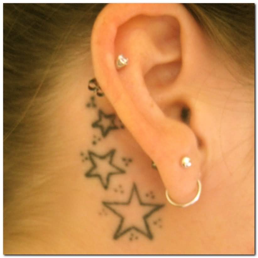 Simple Black Outline Stars Tattoo On Right Behind The Ear