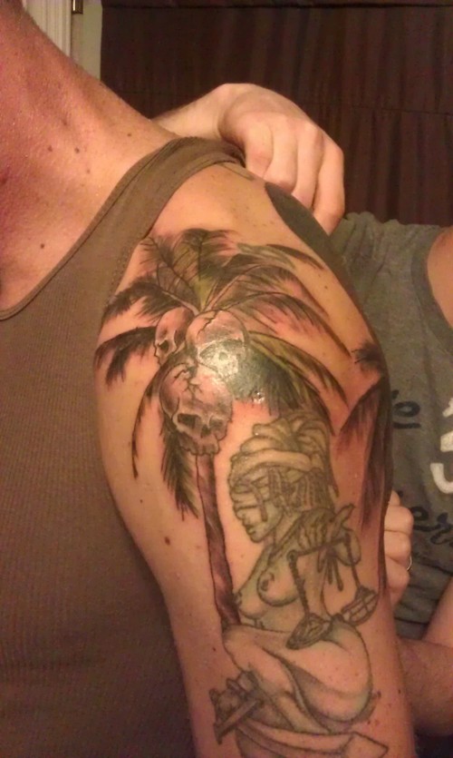 Skulls On Palm Tree Tattoo On Left Shoulder