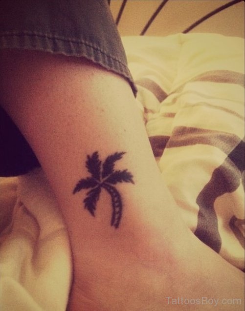 Small Black Palm Tree Tattoo On Leg