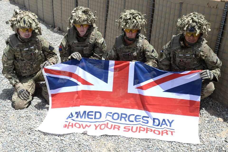 Soldiers From 2nd Battalion The Royal Regiment Of Scotland With Armed Forces Day Flag