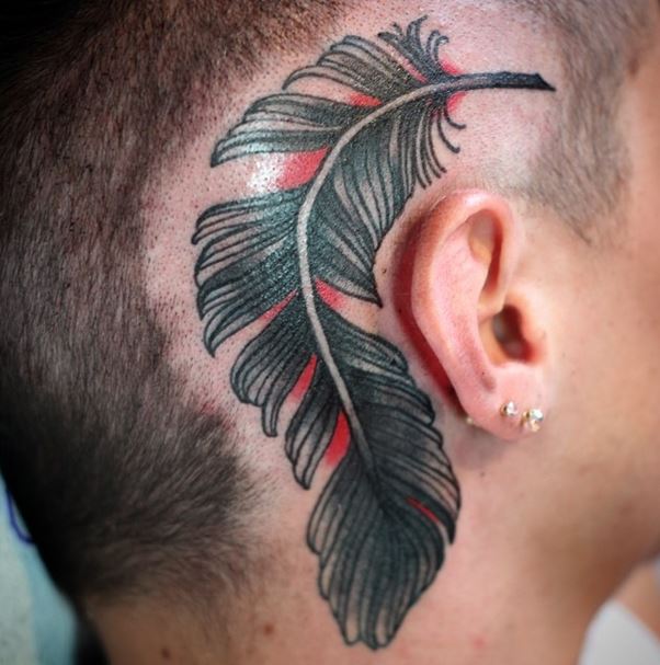 Traditional Feather Tattoo On Man Right Behind The Ear