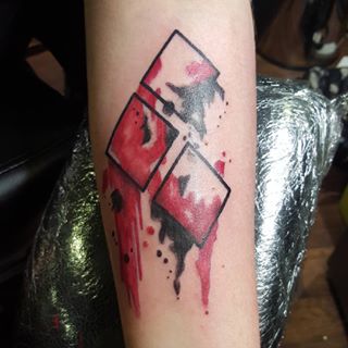 Watercolor Harley Quinn Symbol Tattoo Left Forearm