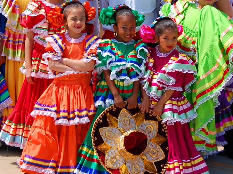 Young Girls Wearing Traditional Mexican Dresses During Cinco de Mayo Celebration