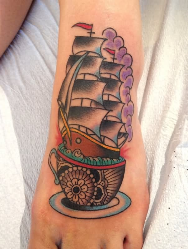 Beautiful Ship In Teacup Tattoo On Left Foot