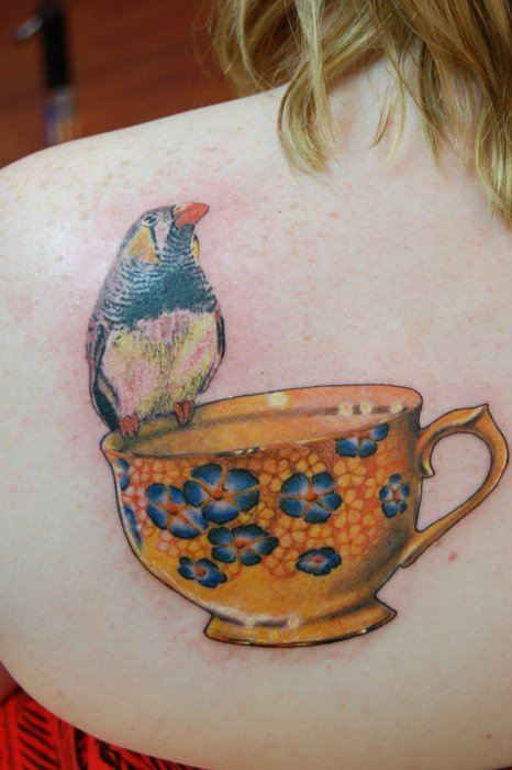 Bird And Teacup Tattoo On Upper Back
