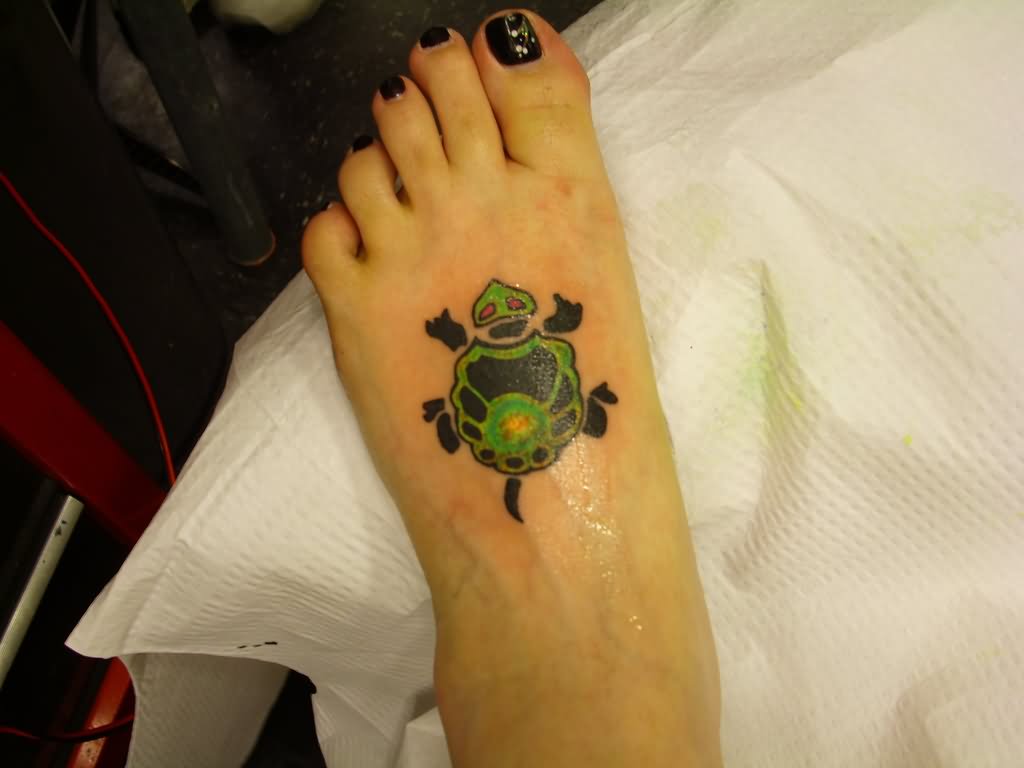 Black And Green Ink Baby Turtle Tattoo On Left Foot