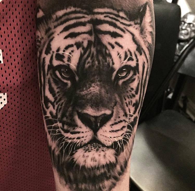 Black And Grey Ink Tiger Head Tattoo On Sleeve