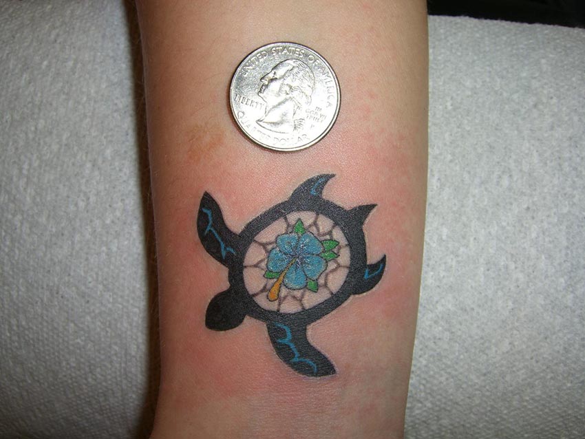 Blue Flower In Turtle Tattoo On Leg