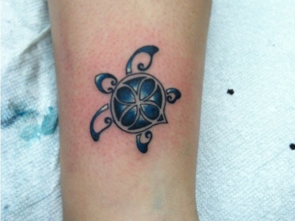 Blue Ink Turtle Tattoo On Bicep