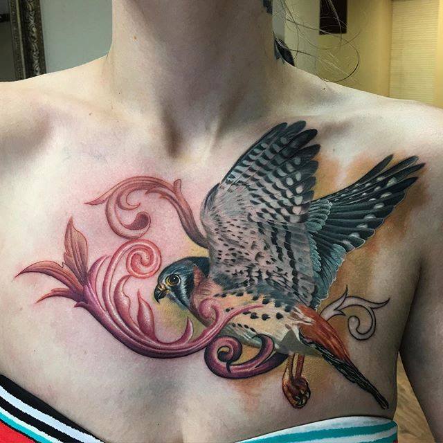 Colored Flying Owl Tattoo On Front Shoulder