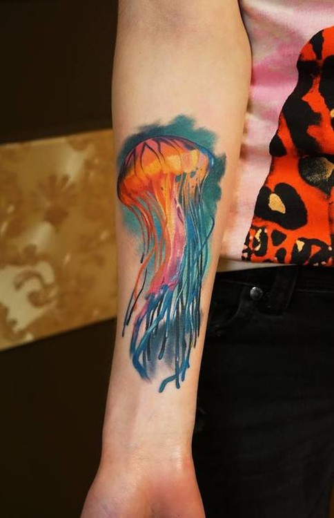 Colored Jellyfish Tattoo On Girl Right Forearm