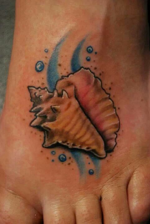 Conch Tattoo On Left Foot