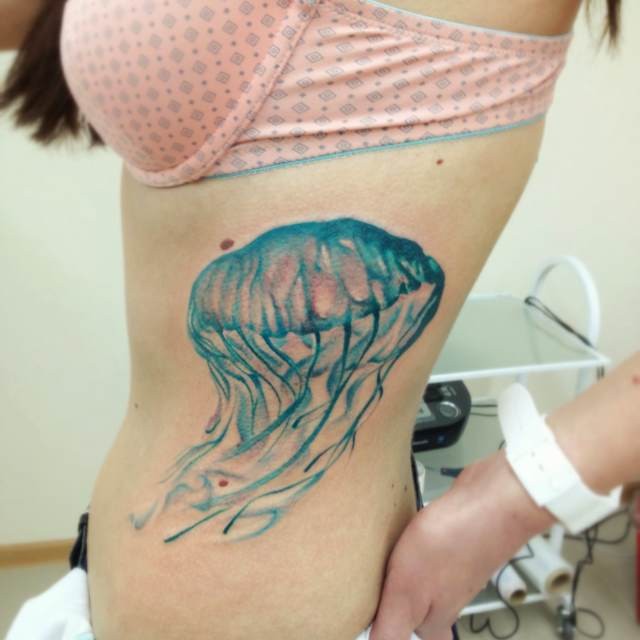Cute Jellyfish Tattoo On Girl Side Rib