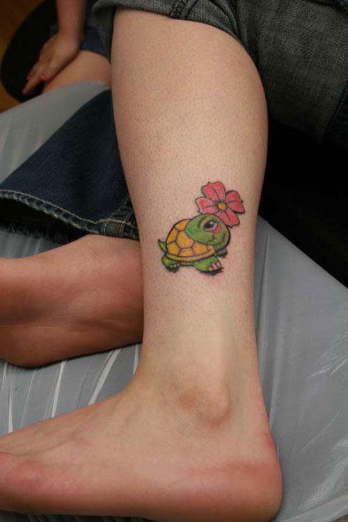 Flower And Turtle Tattoo On Left Leg