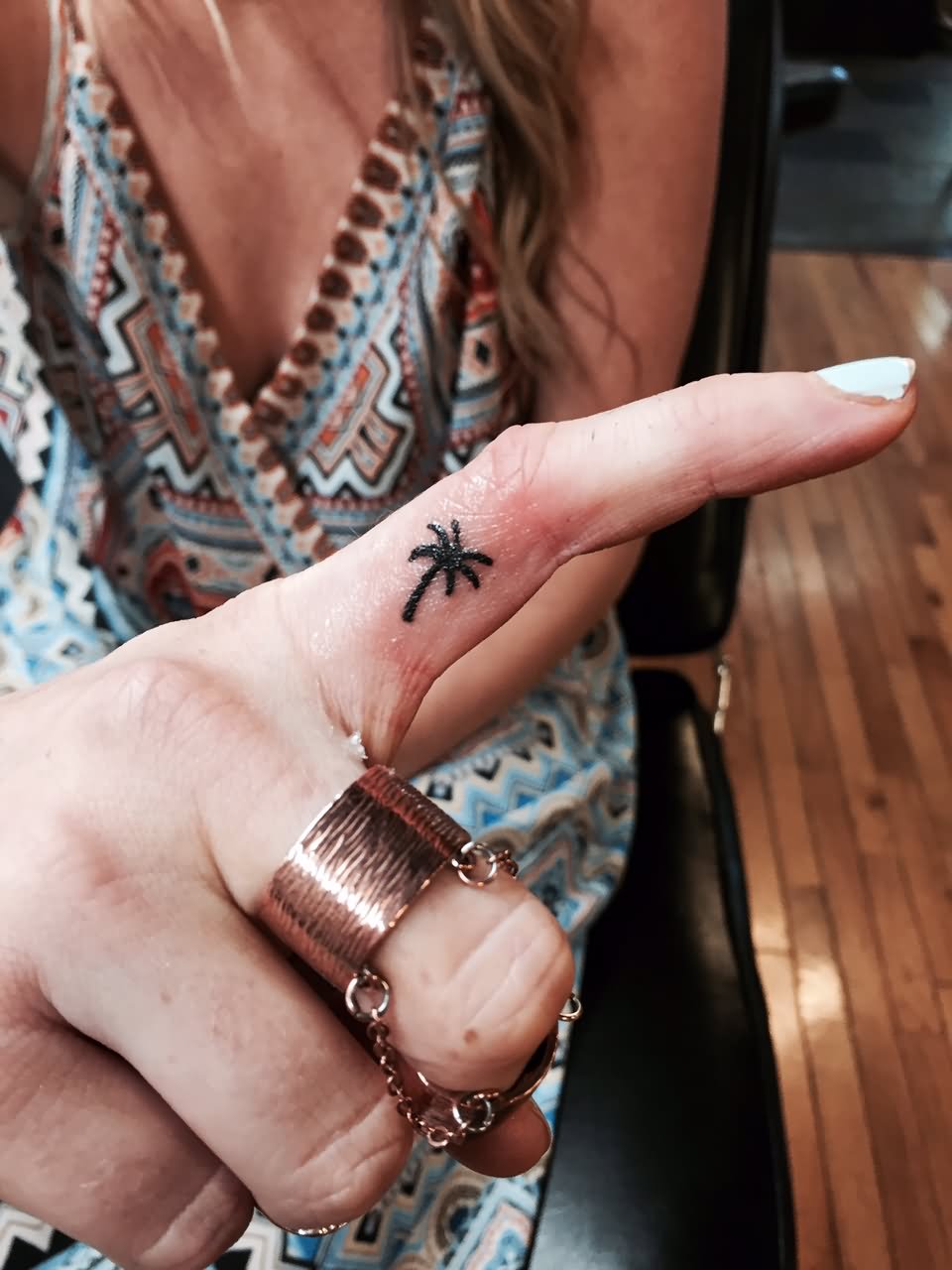 Girl Showing Her Palm Tree Finger Tattoo
