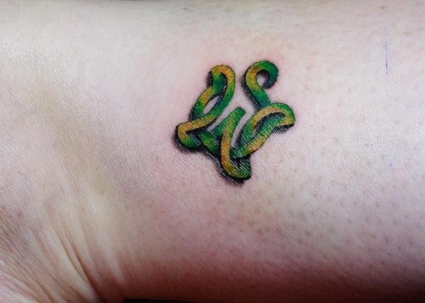 Green Celtic Turtle Tattoo On Wrist