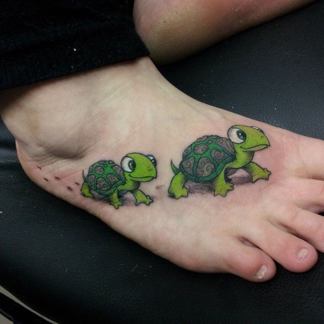 Green Ink Mother Turtle With Baby Turtle Tattoo On Right Foot
