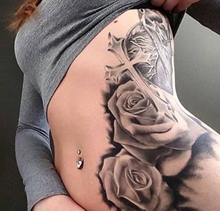 Grey Ink Cross And Roses Tattoo On Left Side Rib