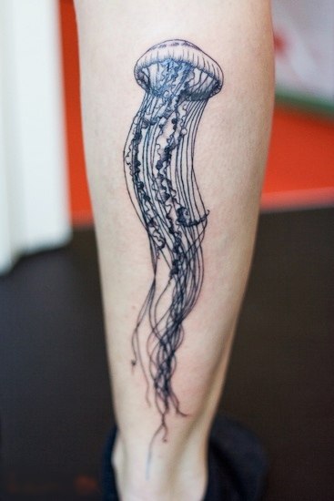 Grey Ink Jellyfish Tattoo On Back Leg