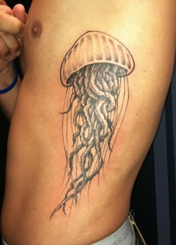 Grey Jellyfish Tattoo On Man Side Rib