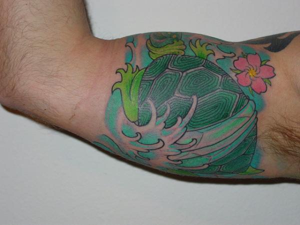 Inner Bicep Colored Turtle Tattoo