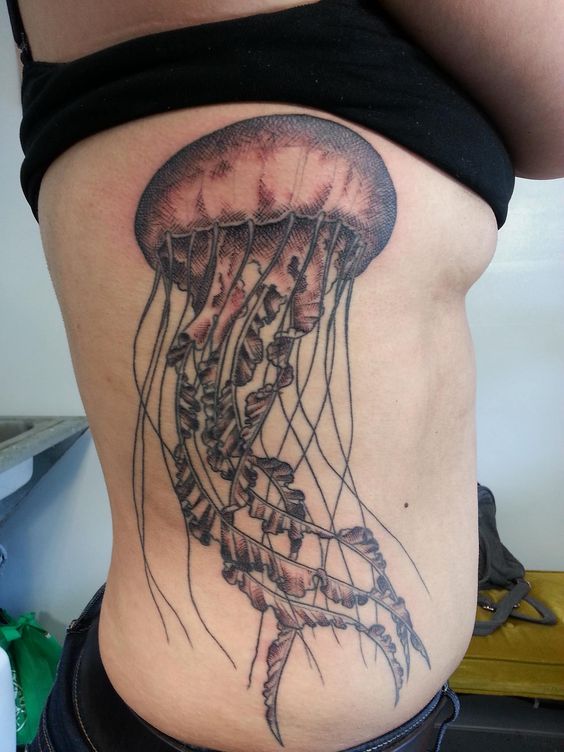 Jellyfish Tattoo On Girl Side Rib