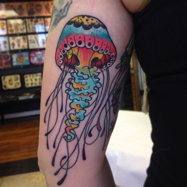 Left Bicep Colored Jellyfish Tattoo