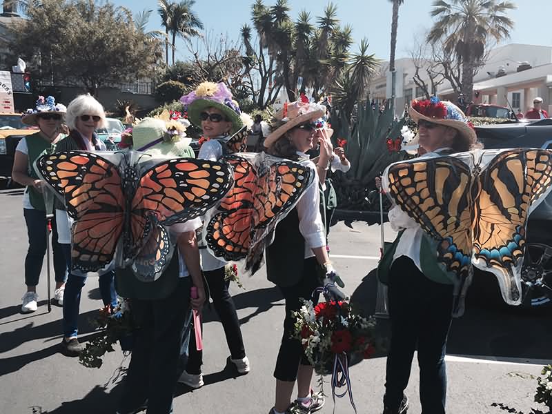 Monarch Ladies Wearing Butterfly Wings Dress During Patriot Day Parade