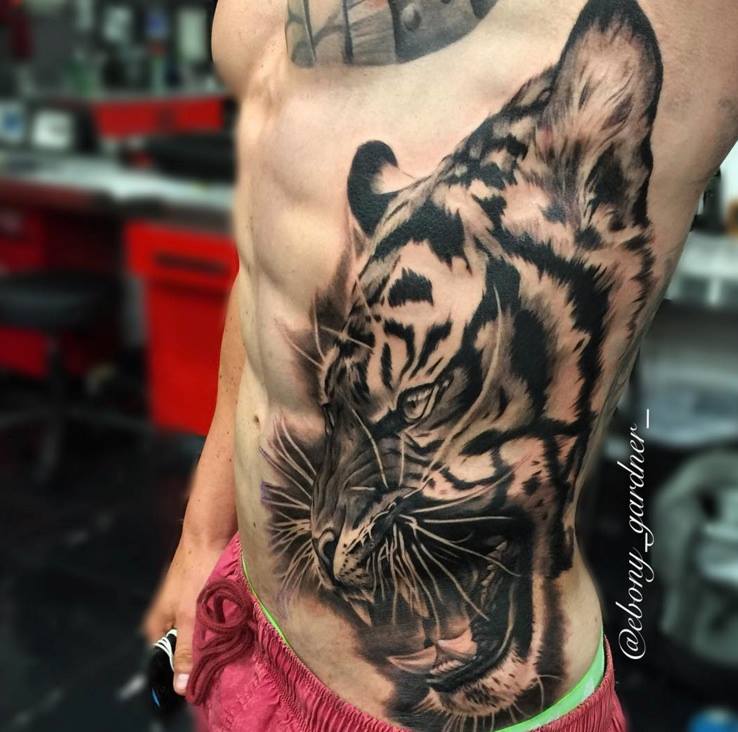 Nice Angry Tiger Tattoo On Left Side Rib