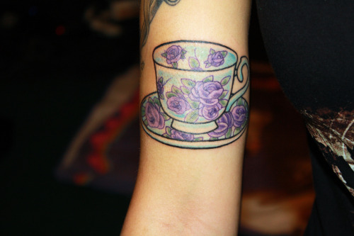 Purple Flowers On Teacup Tattoo On Bicep