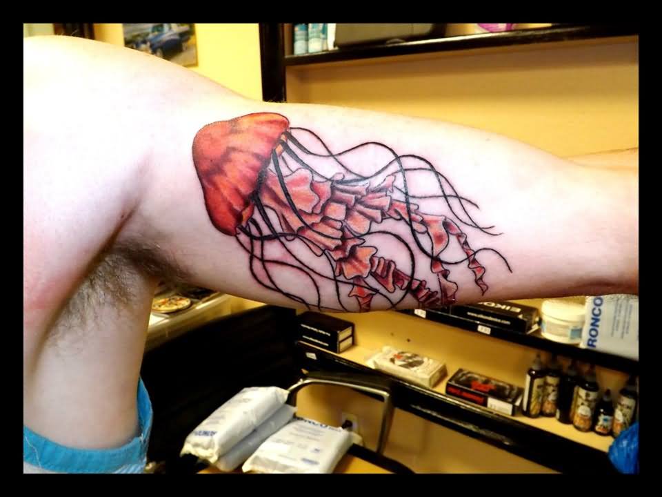 Red Jellyfish Tattoo On Inner Bicep