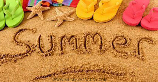 Summer Written On Beach Sand With Flip Flops Happy First Day Of Summer