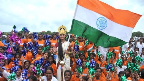 A Lady Dressed As Bharat Mata Posing With Kids During Independence Day Celebrations
