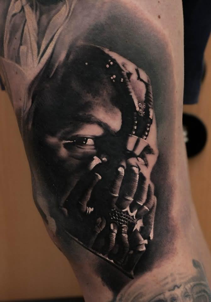 Black And Grey 3D Bane Face Tattoo Design For Bicep By Denis Sivak