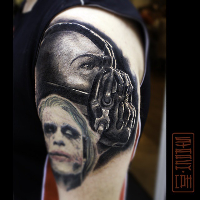 Black And Grey Bane With Joker Face Tattoo Design For Shoulder