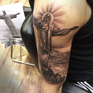 Black And Grey Christ The Redeemer Tattoo On Half Sleeve