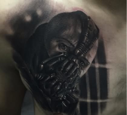 Black Ink Bane Face Tattoo On Man Chest