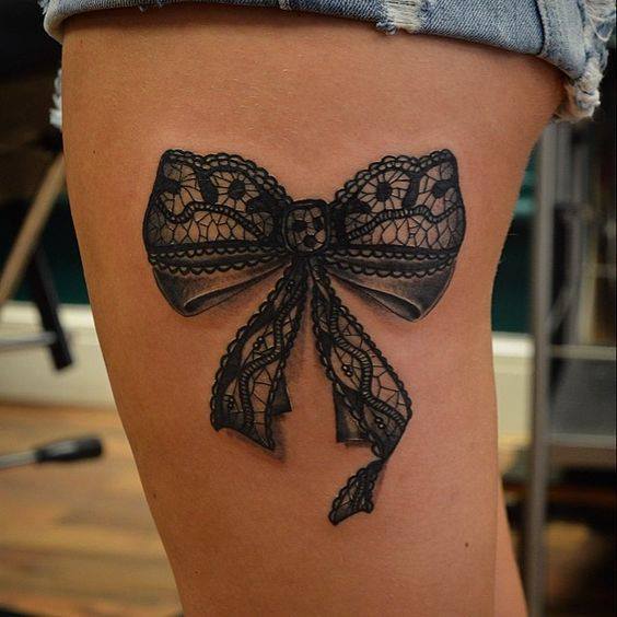 Black Ink Lace Bow Tattoo On Side Thigh