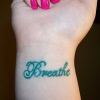 Breathe Lettering Tattoo On Girl Right Wrist